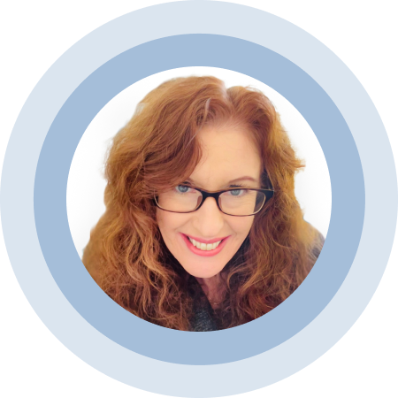 Woman with long hair and glasses smiling against a white background, framed by a blue circle.