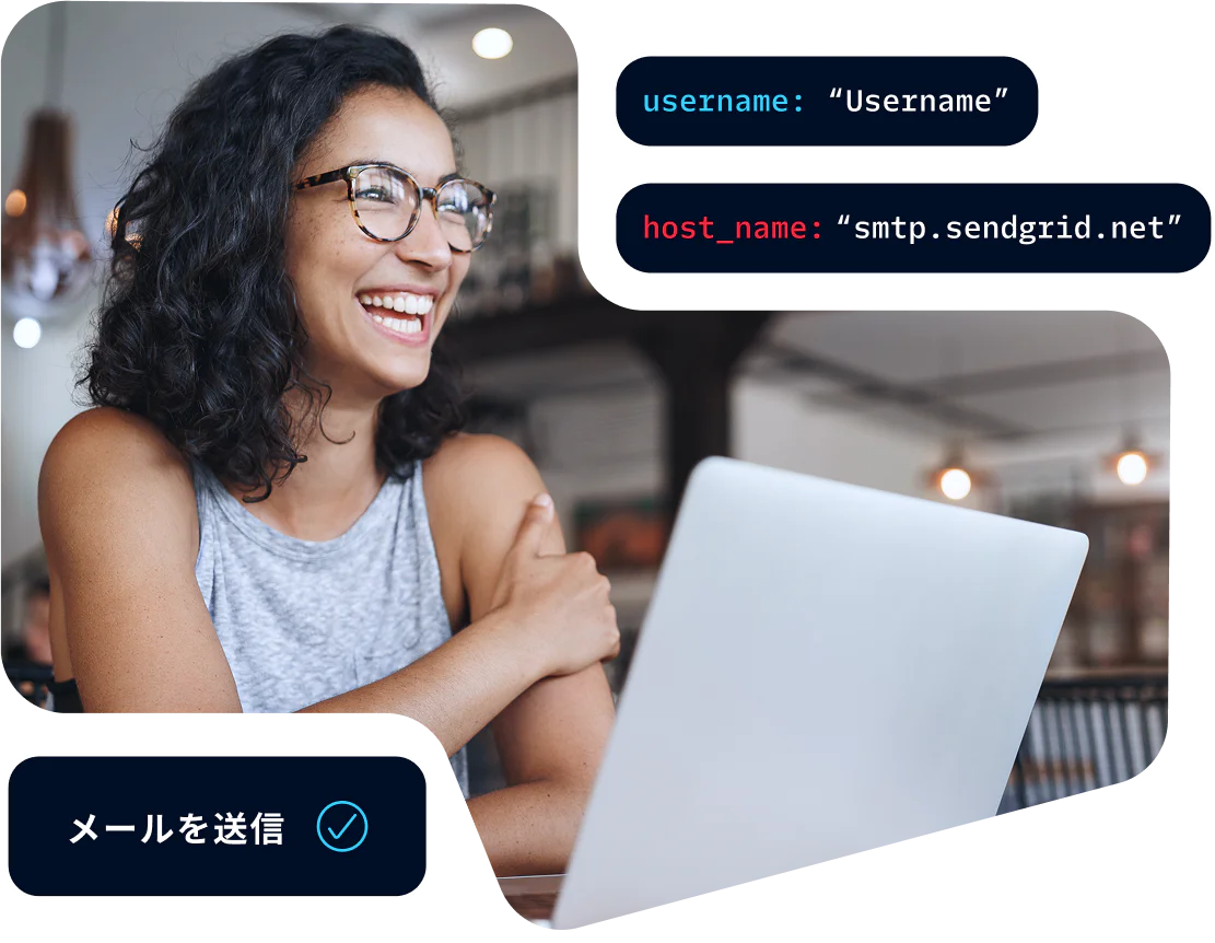 Woman wearing glasses smiling and working on a laptop with an email sent notification displayed.