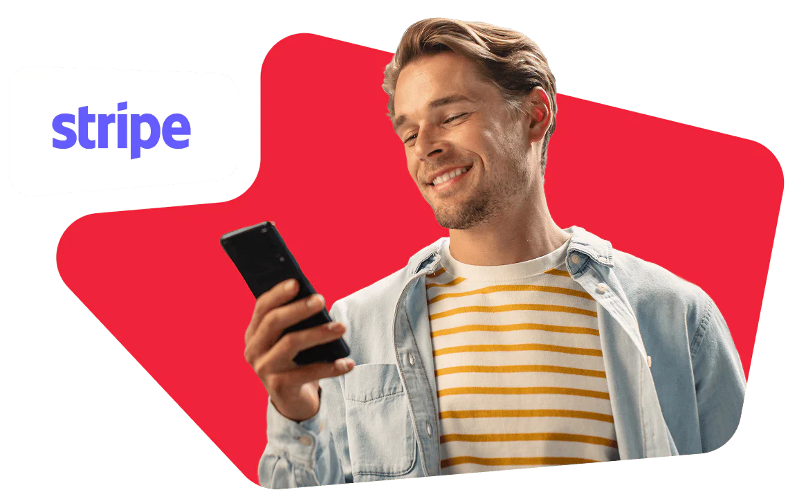 Man smiling and looking at his smartphone, wearing a striped shirt and light jacket, with a Stripe logo.