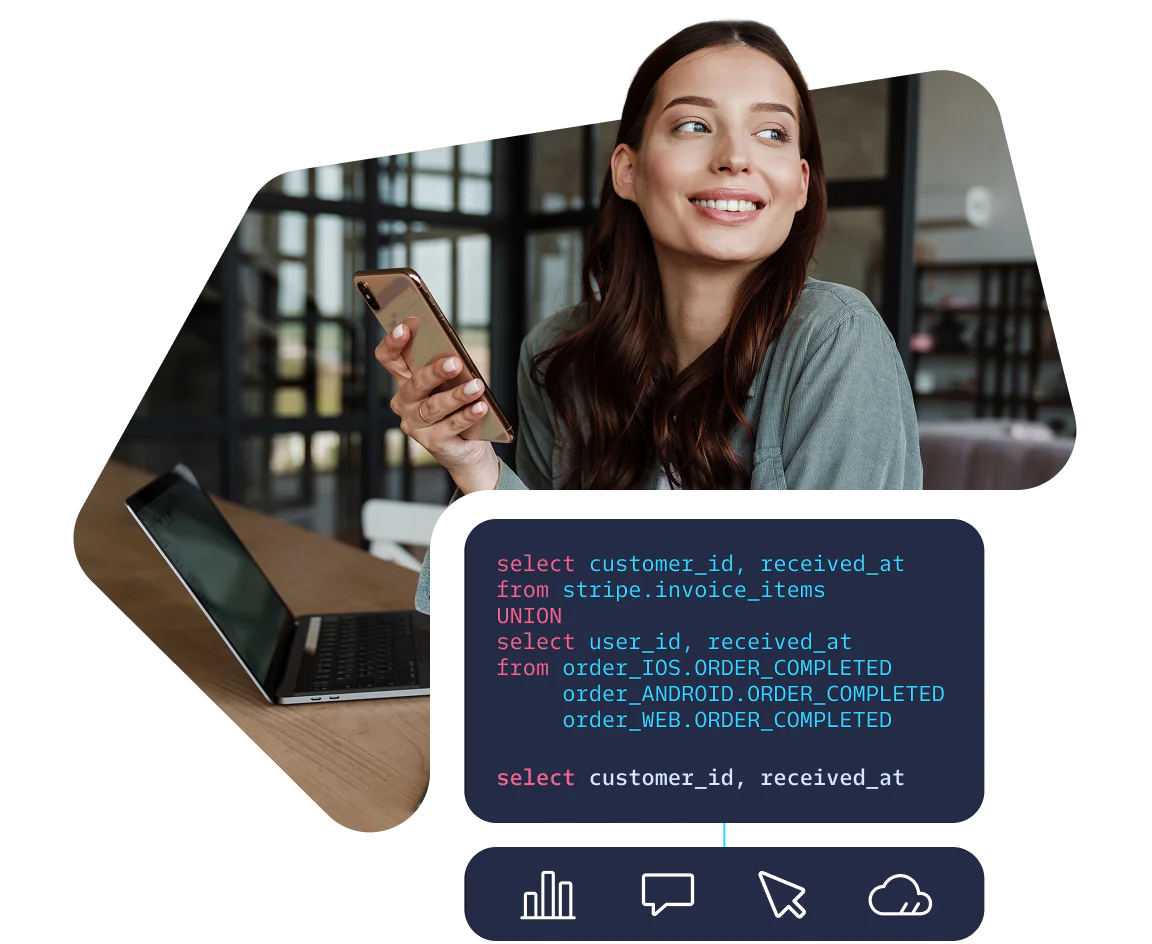 Woman Analyzing Data Scripts on Laptop and Phone Smiling woman holding phone, sitting by a laptop with SQL code displayed on the screen.