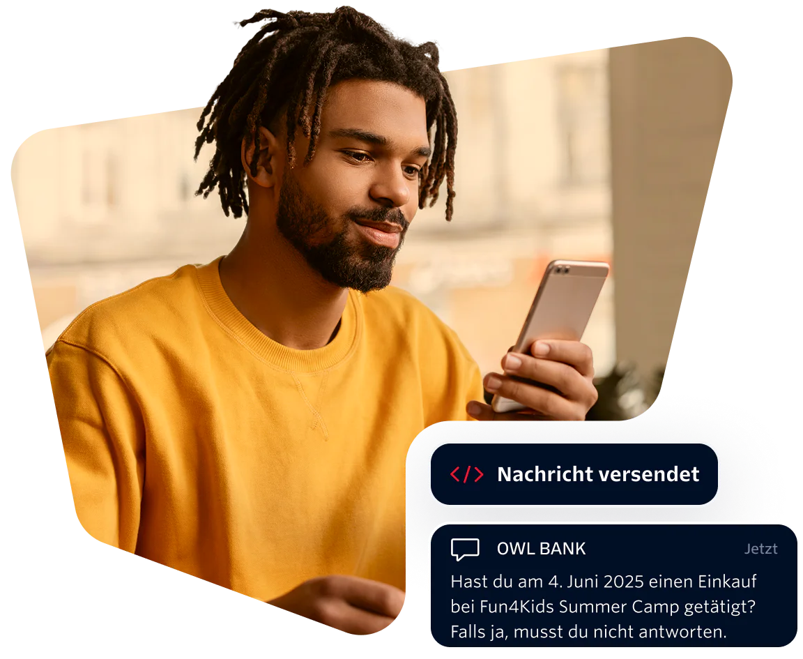 Man in yellow shirt looking at phone with a message from Owl Bank about a summer camp purchase.