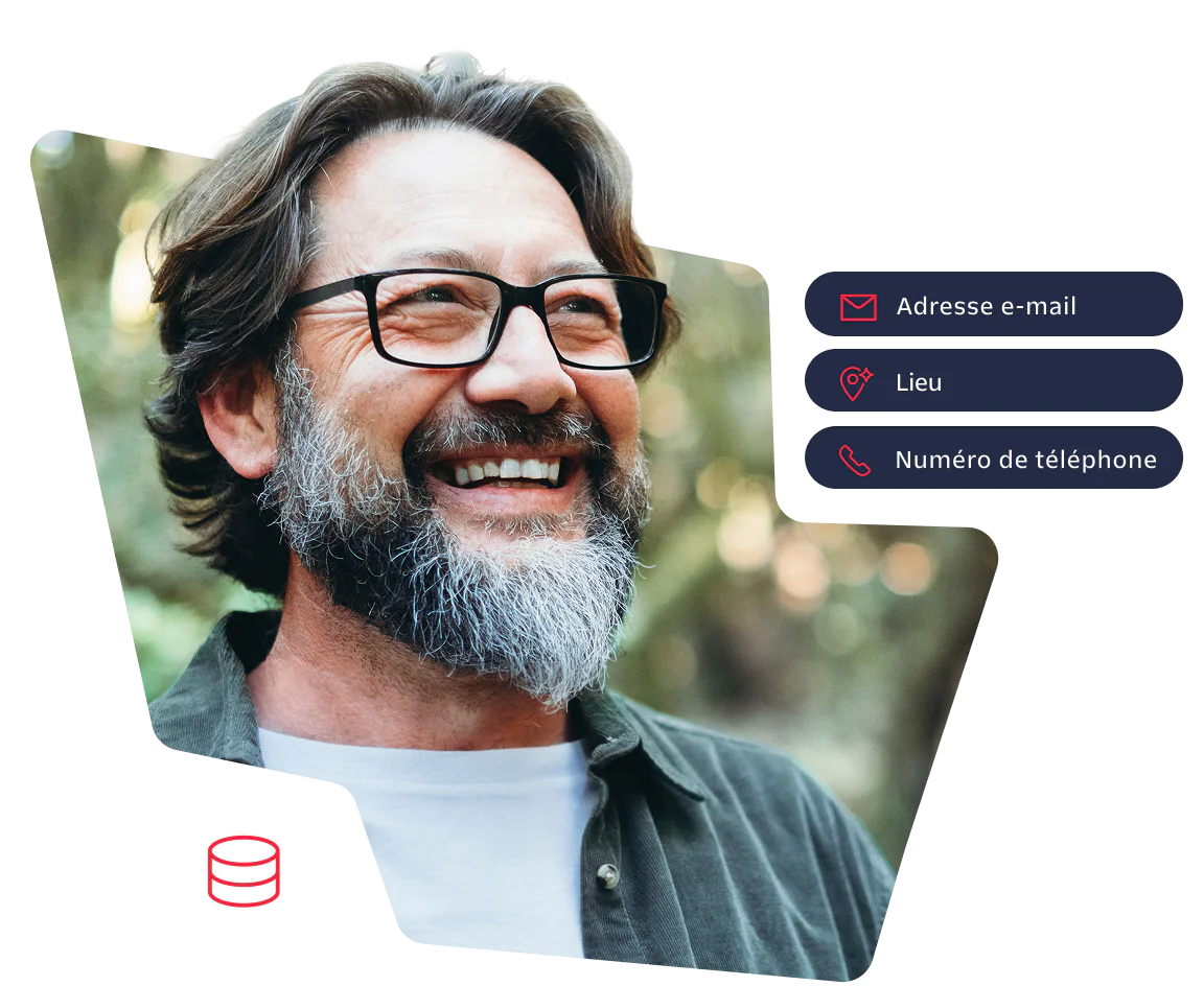 Happy man with glasses and beard in a forest setting Smiling man with glasses and beard standing outdoors in a forest background.
