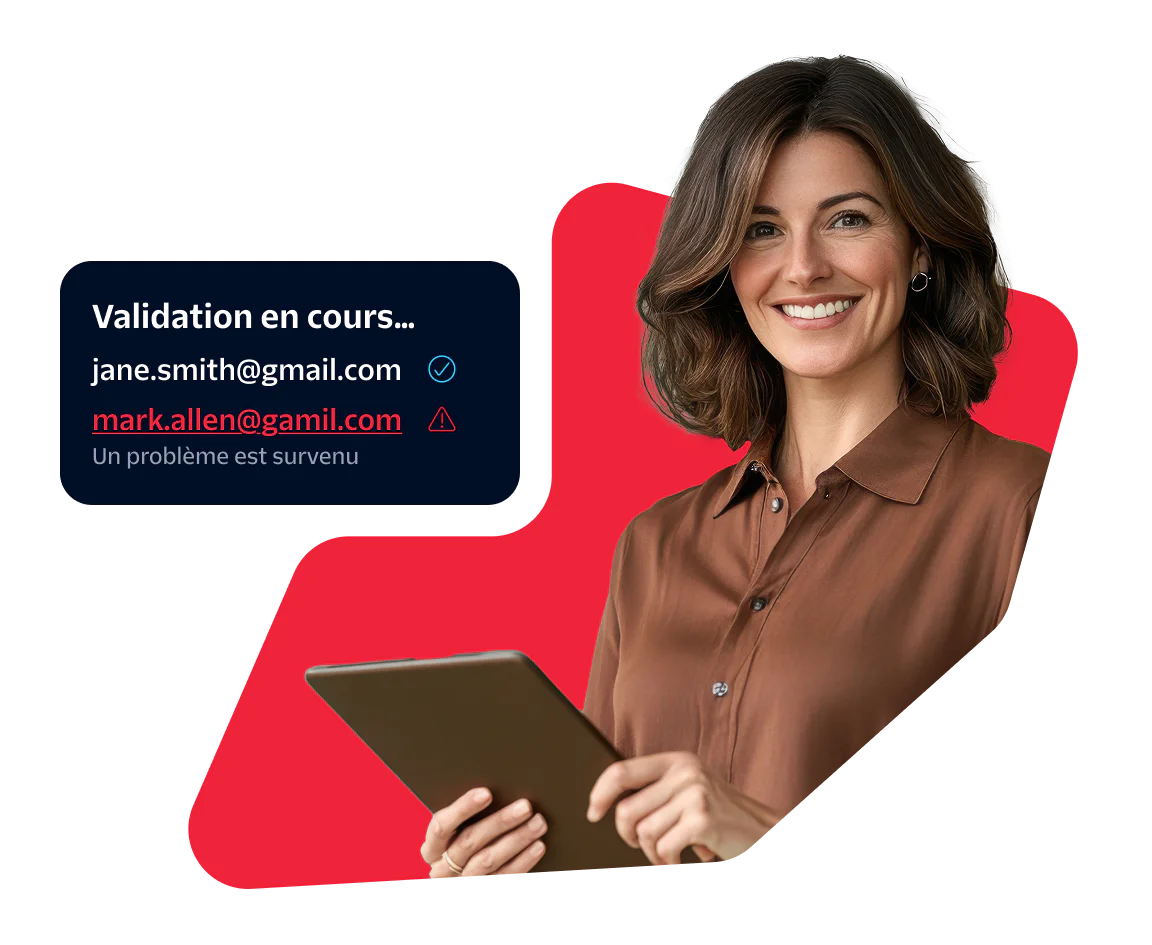 Woman using a tablet while validating email addresses Woman holding a tablet with a screen showing email validation results