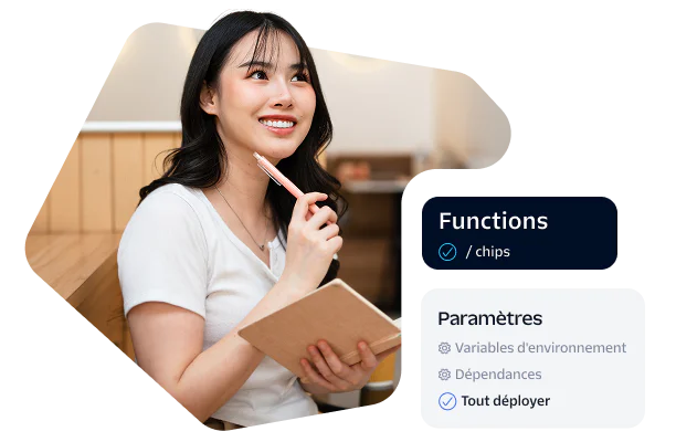 Woman holding a notebook and pen, sitting in a workspace with development settings on the side.