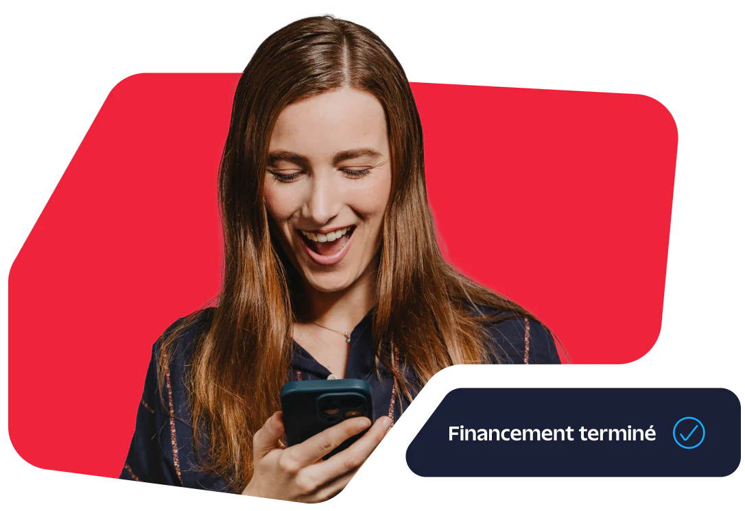 Smiling woman looking at her phone with Financing completed notification.