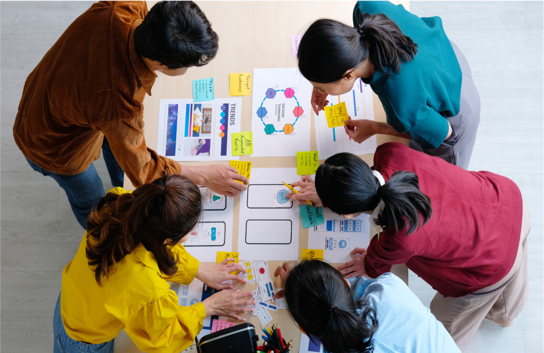 Collaborators problem-solving around a table