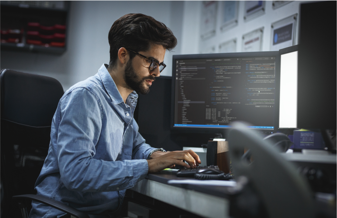 Engineer at a work station developing an auto-responder