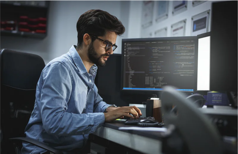 Engineer at a work station developing an auto-responder