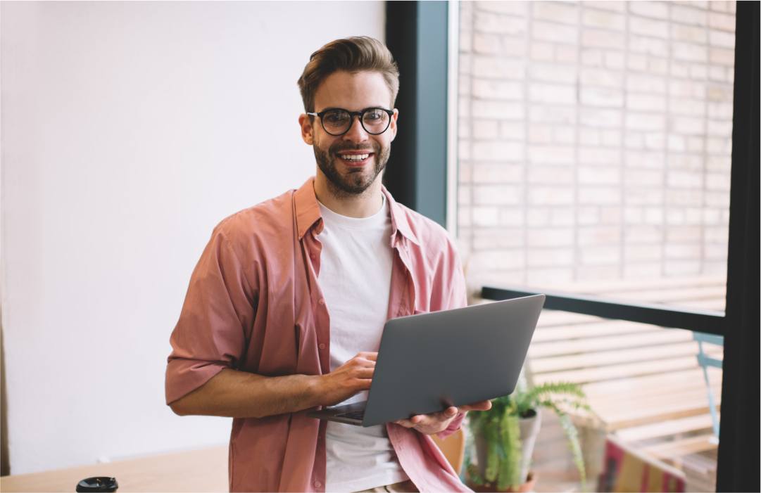 Developer smiling while working on a healthcare app