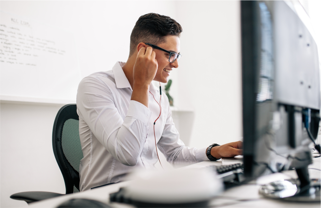 Person on a call on the computer using headphones