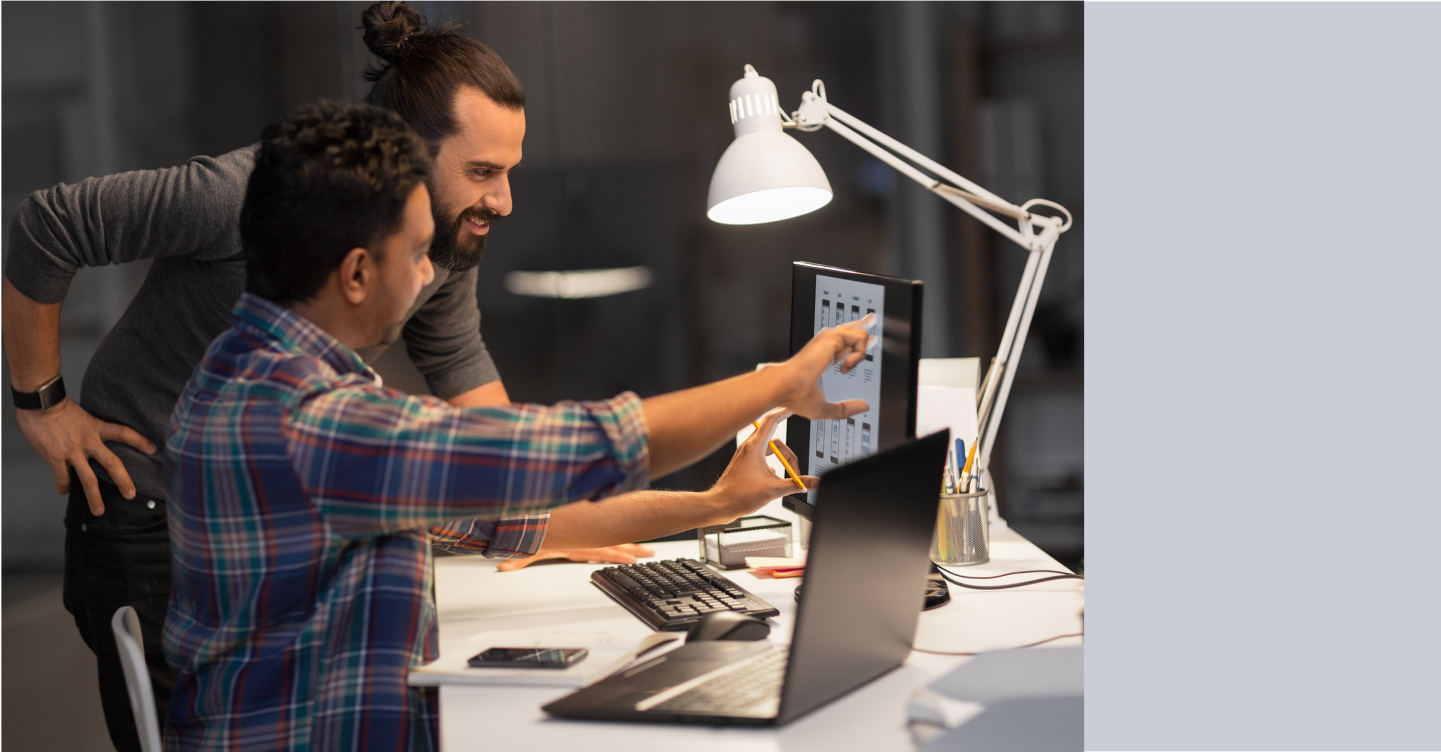 Developer showing coworker how to access Flex from ChatGPT interface on computer