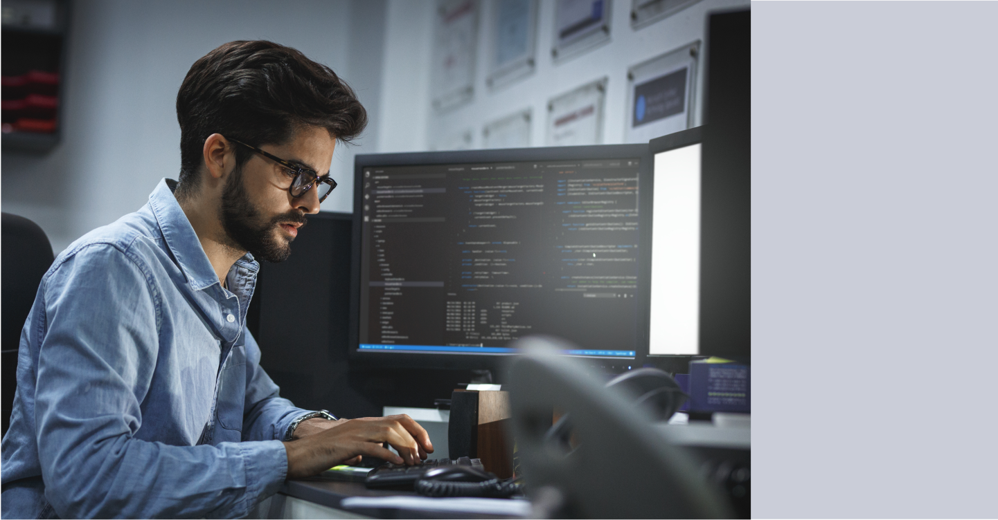 Engineer at a work station developing an auto-responder