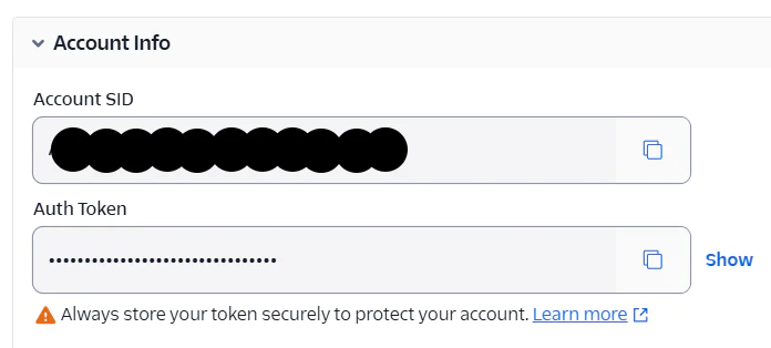 Screenshot showing Twilio account SID and hidden auth token fields.