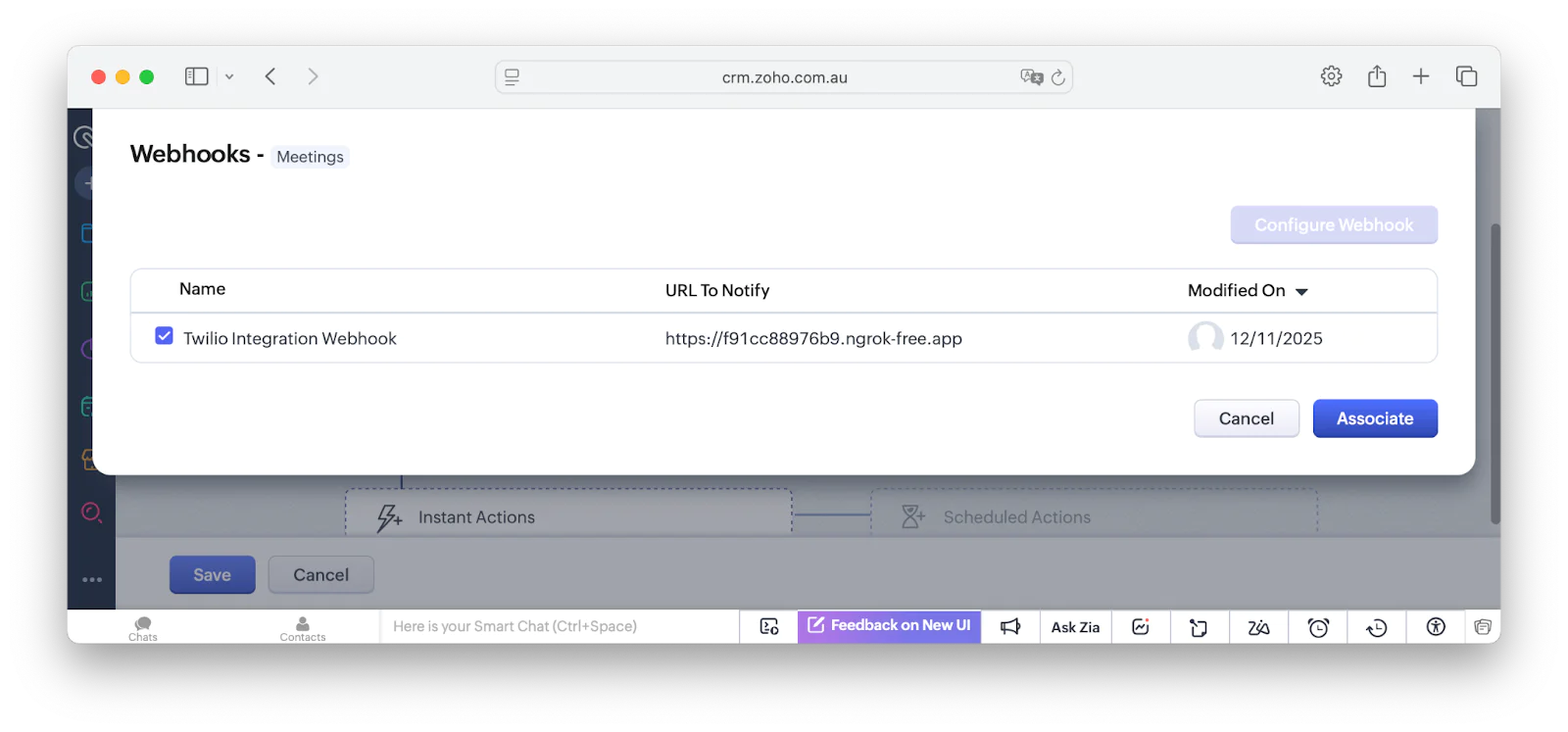 A screenshot showing how to associate a webhook with a workflow in Zoho CRM.