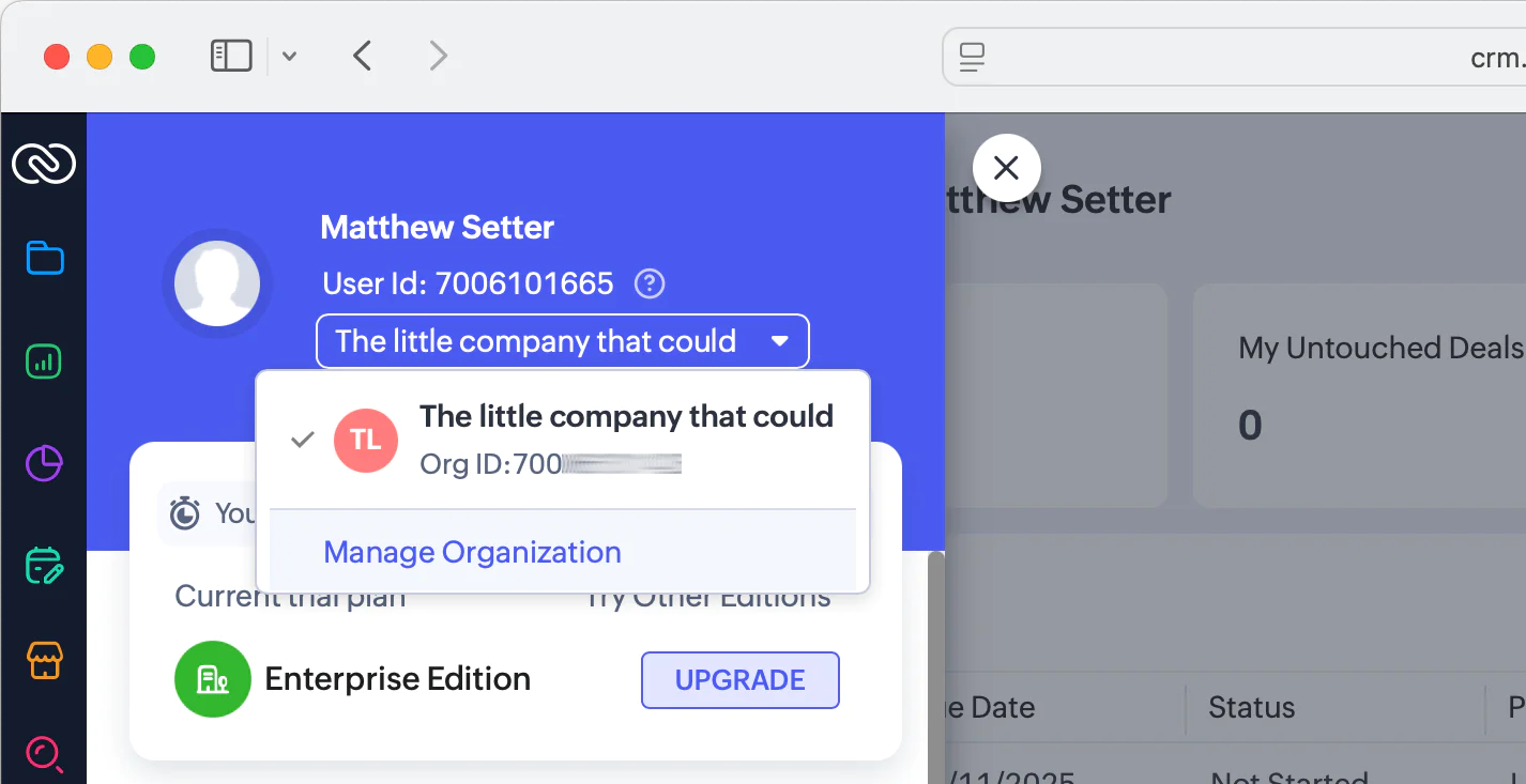 The user details section of the Zoho CRM dashboard, with the organisation popup visible; the actual organisation's id has been redacted after the first three characters.