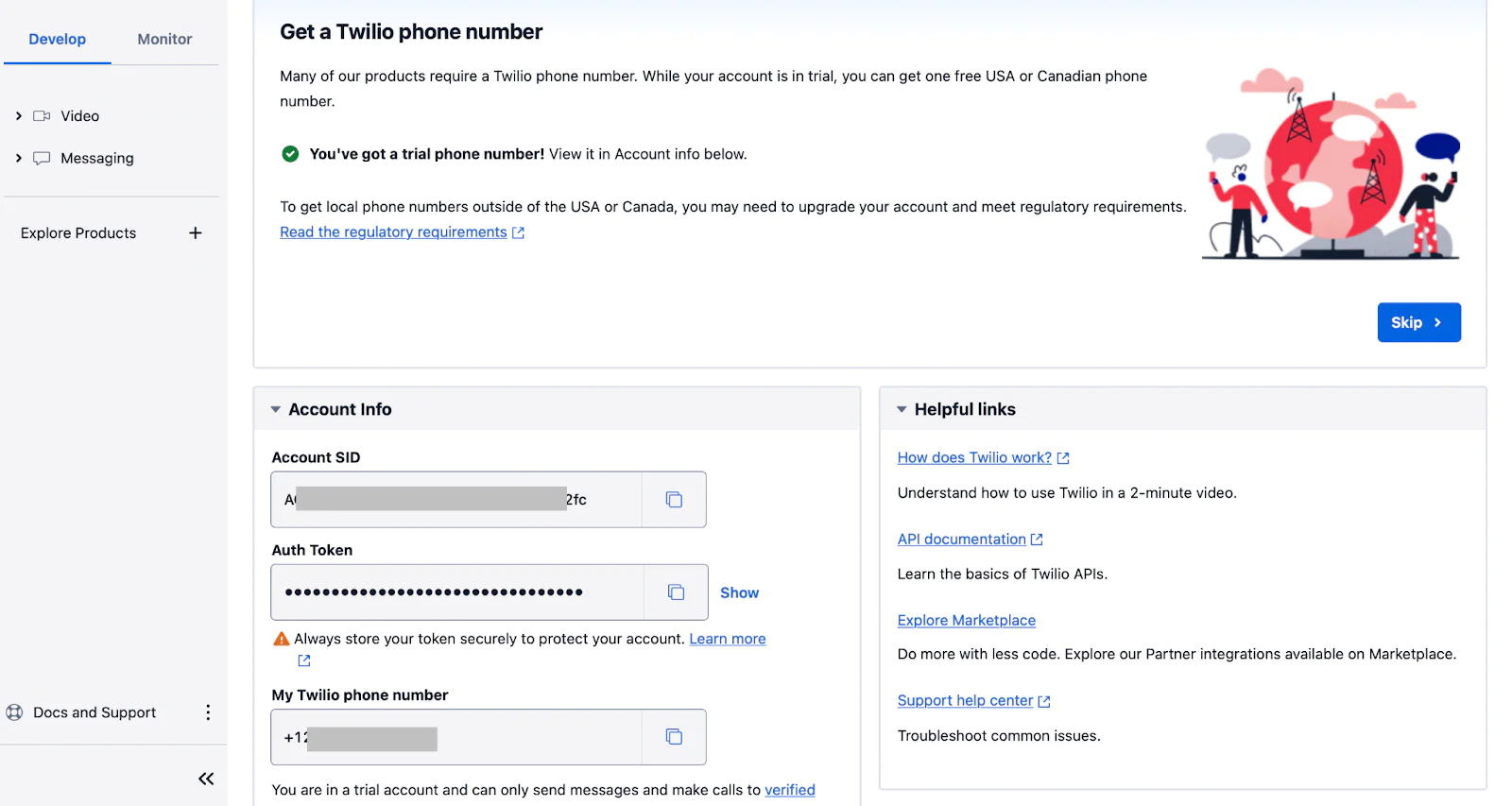 Image of a users Twilio dashboard. The page contains the user Twilio Account SID, Auth token and Twilio phone number. Page has a white and grey background with text in blue and black color. 