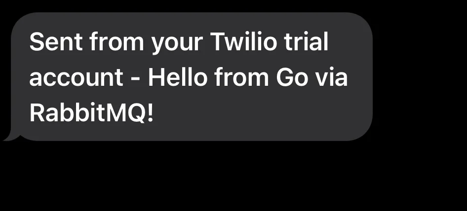 Text message stating it's from a Twilio trial account, mentioning Go and RabbitMQ.