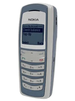 Classic Nokia Mobile Phone Displaying Balance Check Option A classic Nokia mobile phone with a monochrome screen displaying options to check balance or top up, featuring a numeric keypad and basic navigation buttons.