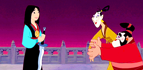GIF of Mulan hugging her friends after receiving the sword from the emperor. 