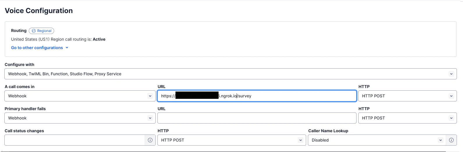 Screenshot of the Twilio Console showing the configuration of a phone number’s Voice Configuration settings with an ngrok URL in the ‘A Call Comes In’ field.