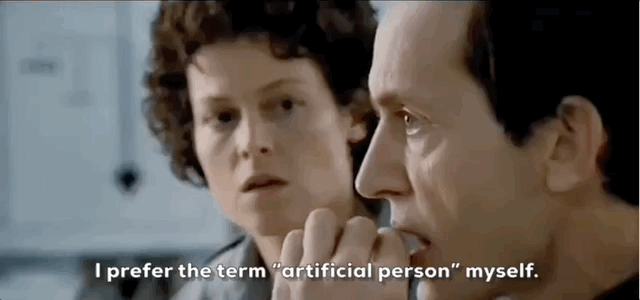 Two people in a serious conversation; one says, I prefer the term 'artificial person' myself.