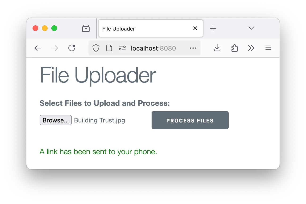 File uploader page with a selected file named Building Trust.jpg and a message stating a link has been sent to your phone.