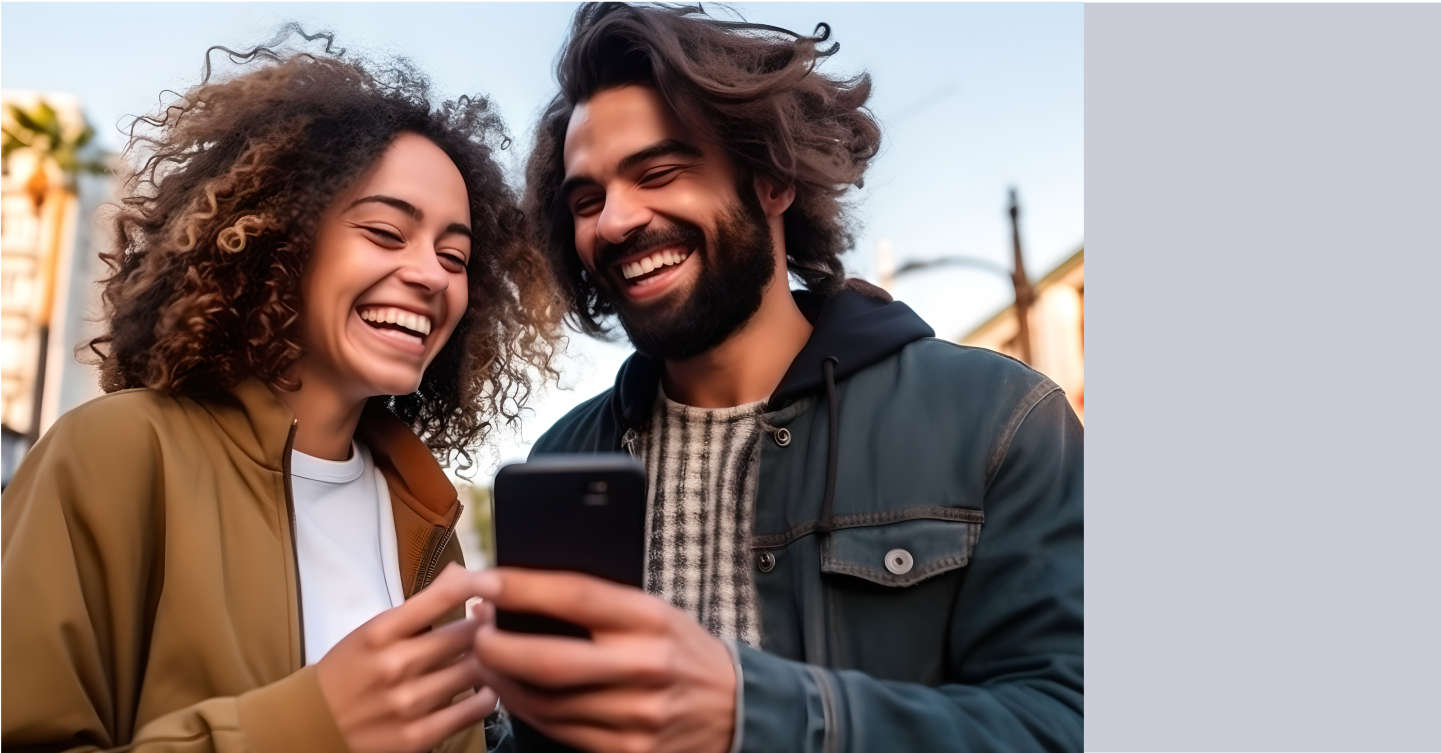 A couple looks at a phone together