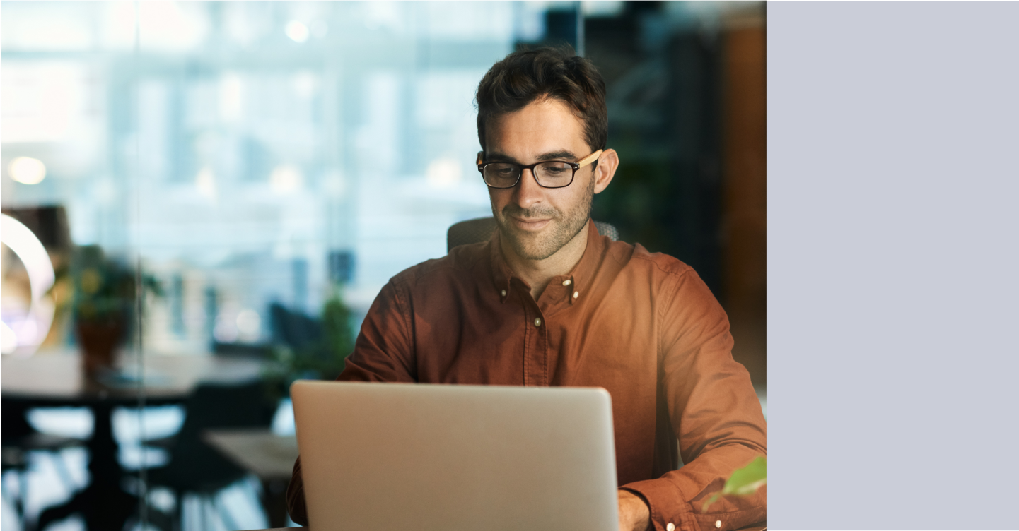 Man harnessing the power of AI on his laptop