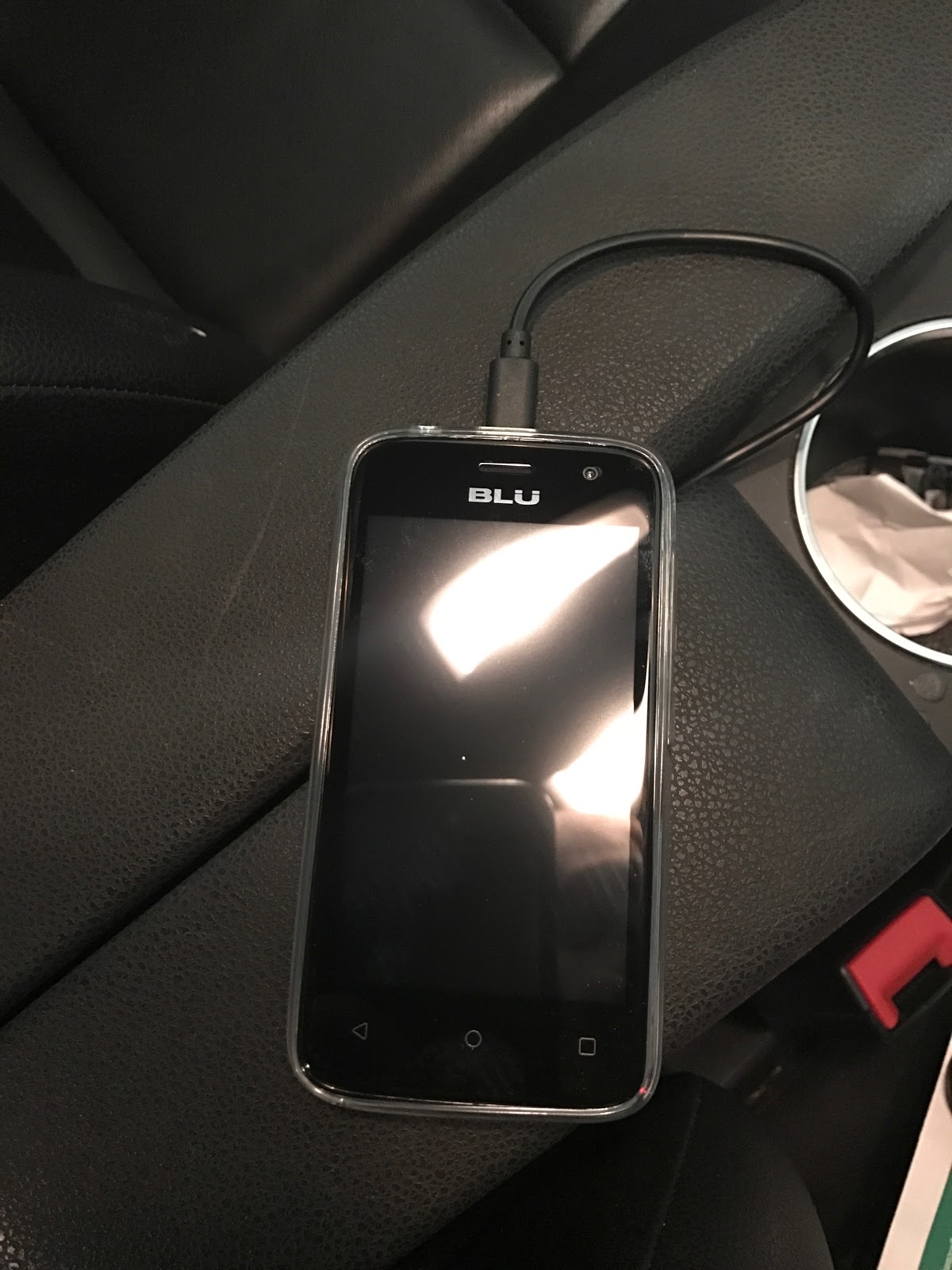 Picture of unlocked phone with Twilio SIM in car