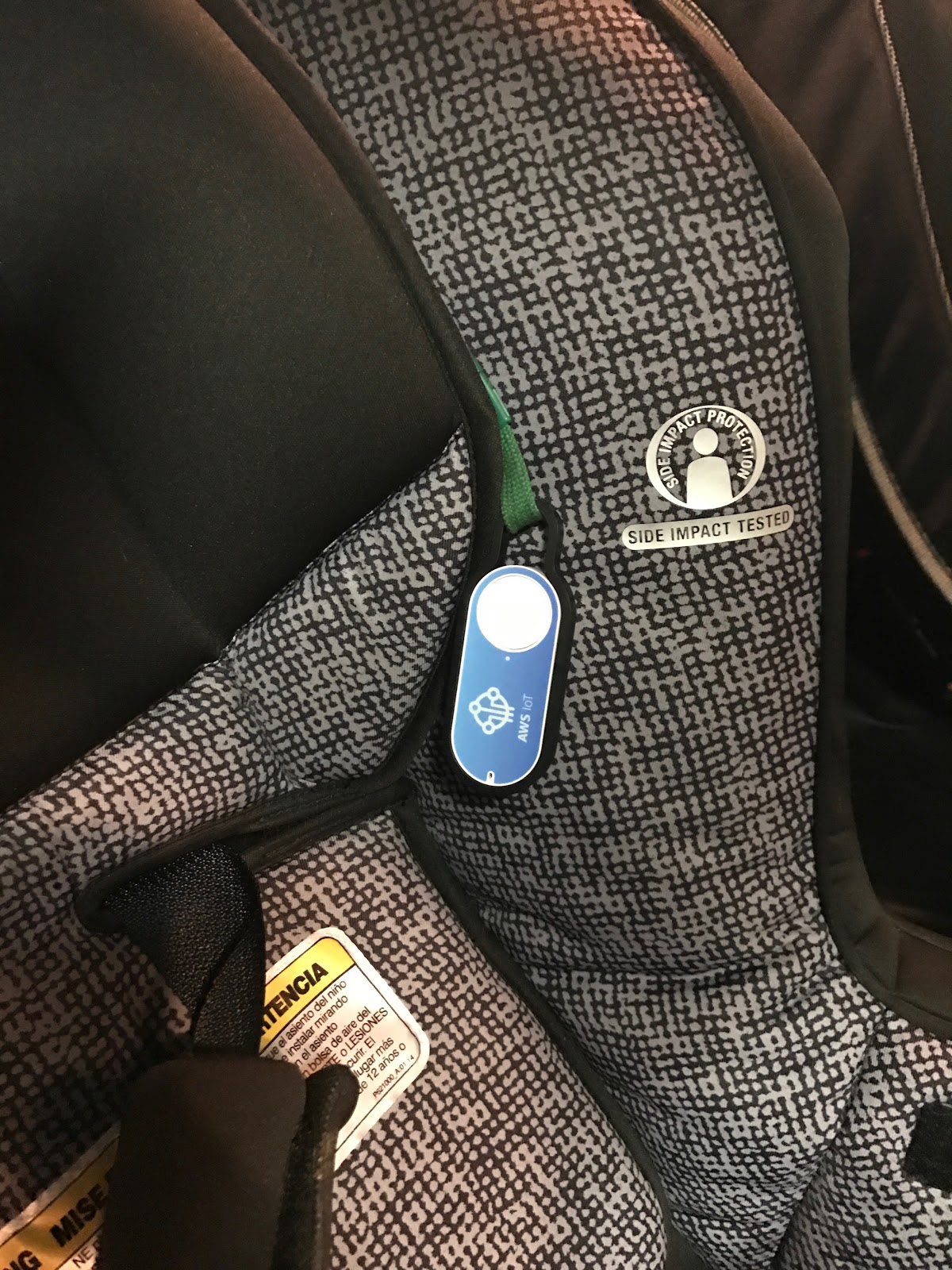 Picture of AWS IoT lifeline Help Button attached to carseat