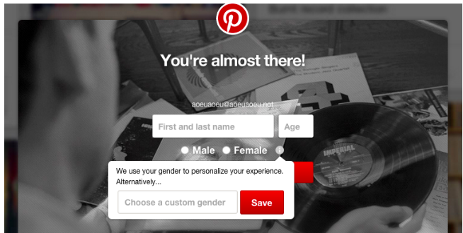 A screenshot of Pinterest&#39;s expanded gender options on signup.  There are input boxes for "First and last name" and "age."  There are radio buttons for "male" and "female" along with an info icon.  There&#39;s a tooltip on the info icon that says "We use your gender to personalize your experience" with a textbox that says "Choose a custom gender" that can be any text value.