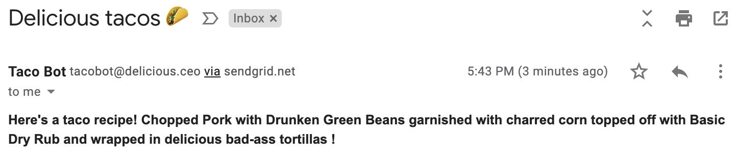 Screenshot of an email from "Taco Bot." The subject line is "Delicious tacos 🌮" and the body is "Here&#39;s a taco recipe! Chopped pork with drunken green beans garnished with charred corn topped off with basic dry rub and wrapped in delicious bad-ass tortillas!"