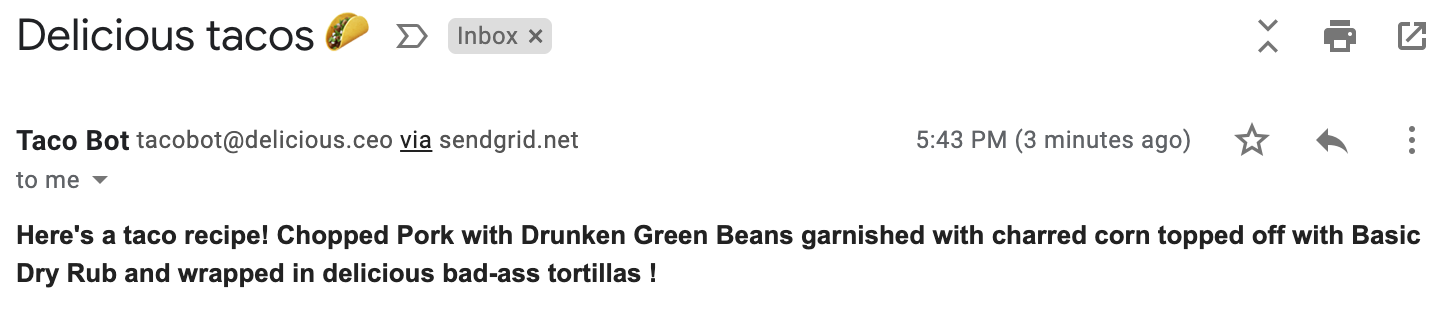 Screenshot of an email from "Taco Bot." The subject line is "Delicious tacos 🌮" and the body is "Here's a taco recipe! Chopped pork with drunken green beans garnished with charred corn topped off with basic dry rub and wrapped in delicious bad-ass tortillas!"