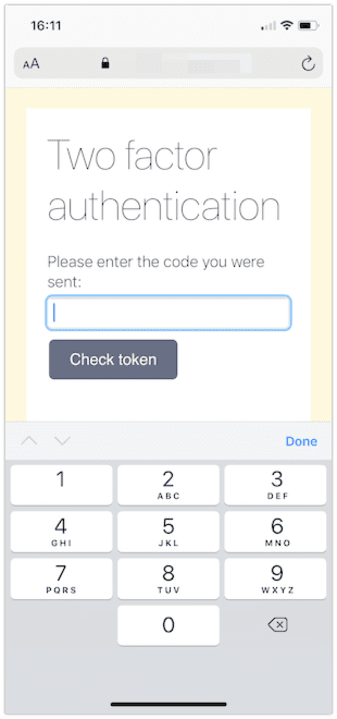 A web page shown in iOS Safari with a two factor authentication prompt. This time a simple keyboard of just numbers appears.