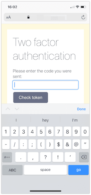 A web page shown in iOS Safari with a two factor authentication prompt. This time the keyboard includes numbers and symbols.