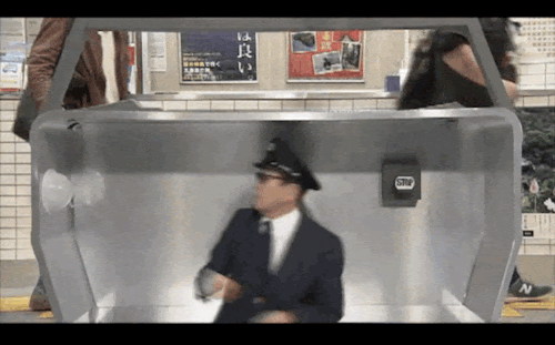 officer at train station inserting clipper card