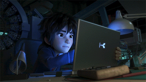 Hiro from Disney's Big Hero 6 touching up Baymax design on a tablet