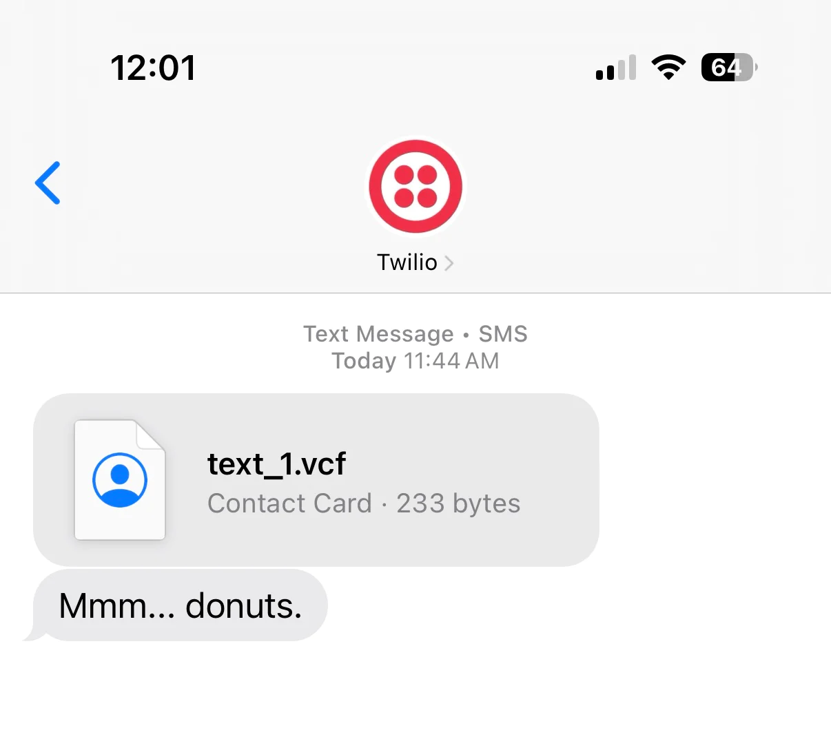 SMS with Contact Card Received on iPhone iPhone screen showing a received SMS with a vCard attachment and the message “Mmm... donuts.”