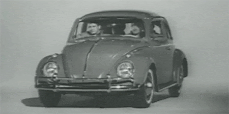 black and white animated gif of four men getting out of a Volkswagon bug and then disassembling it completely.