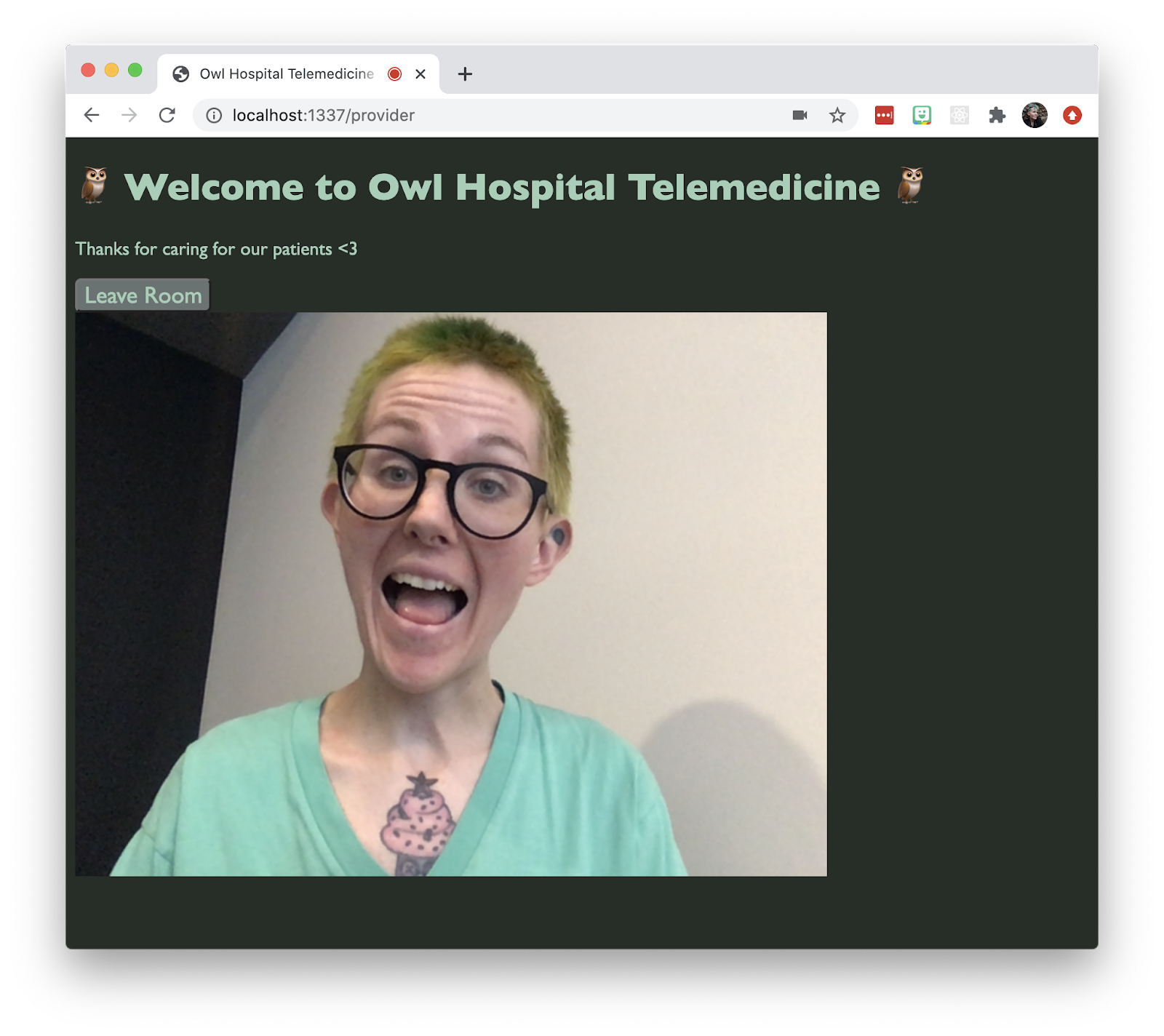 Screenshot of a Twilio Video app that says "Welcome to Owl Hospital Telemedicine." Small text says "Thanks for caring for our patients." There's a button that says "Leave Room" and a non-binary person in the video chat, with green hair, making a silly face.