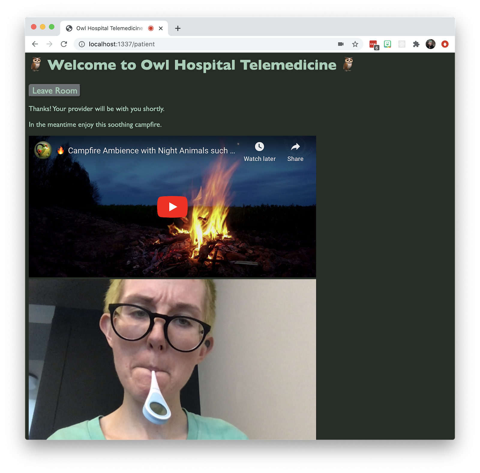 Screenshot of a Twilio Video telemedicine app. There is a non-binary person in the video chat, that has a thermometer in their mouth and a pensive expression. The text on the page says "Thanks! Your provider will be with you shortly. In the meantime enjoy this soothing campfire." There is an embedded YouTube video of a campfire.
