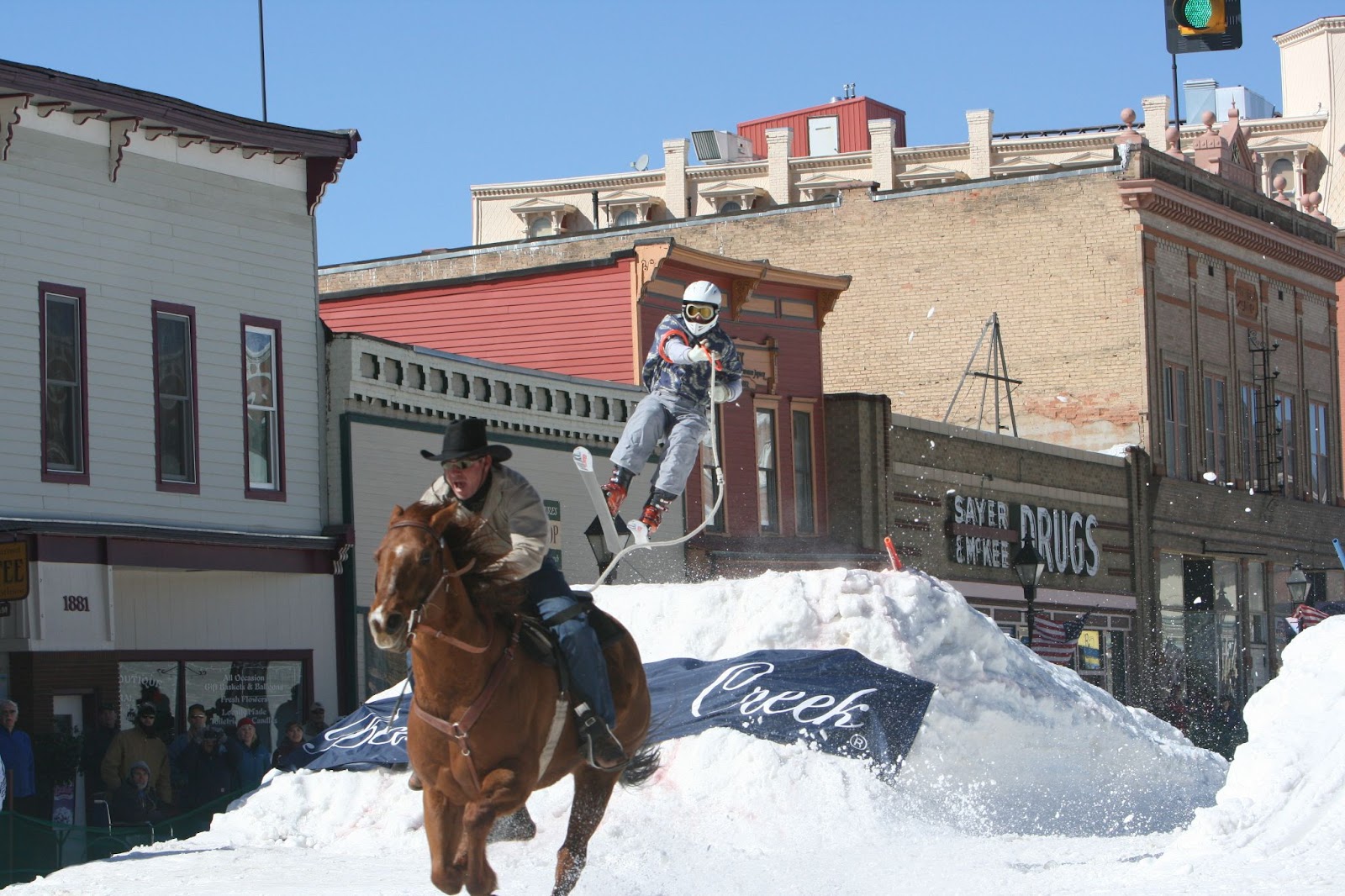A person on skis being pulled by a horse in a 2009 Skijoring event in Leadville, Colorado. Photo by Kaila Angello