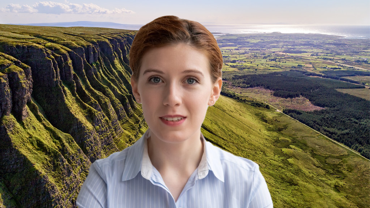The person&#x27;s image appears in front of a background image of green mountains and valleys.
