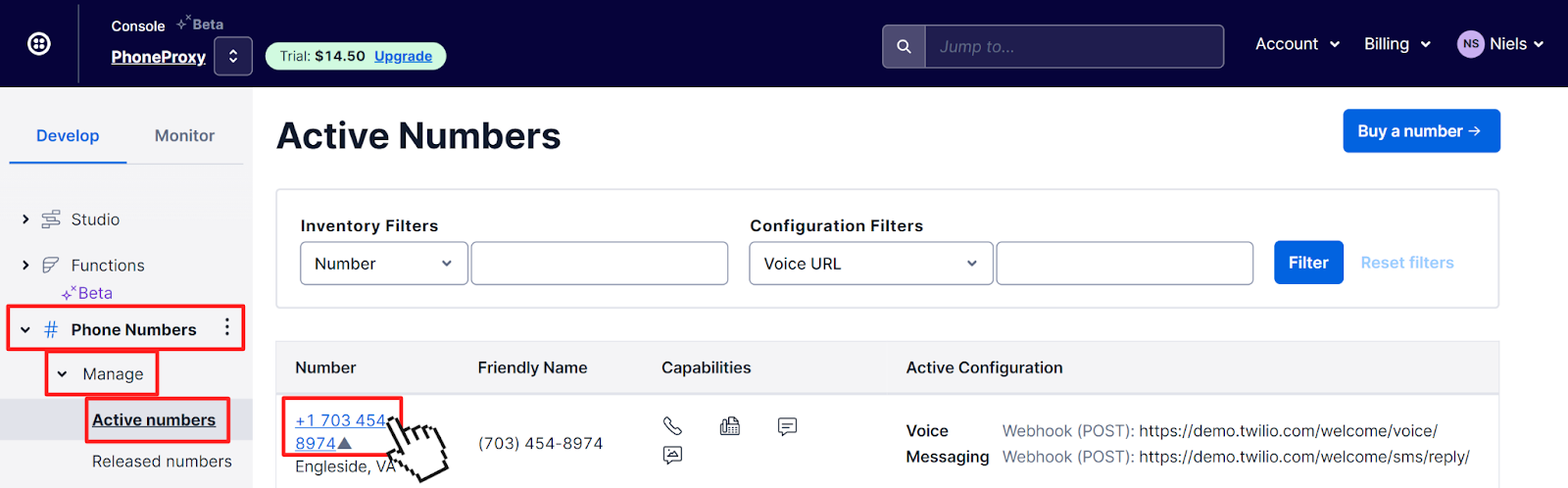 Twilio Console listing active phone number in the Twilio Account. Pointer is clicking on the active phone link.