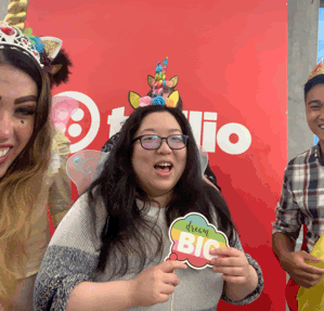 Twilio SIGNAL 2019 Radical Inclusivity welcome event photobooth gif featuring five attendees wearing unicorn horns, crowns, fairy wings, and capes.