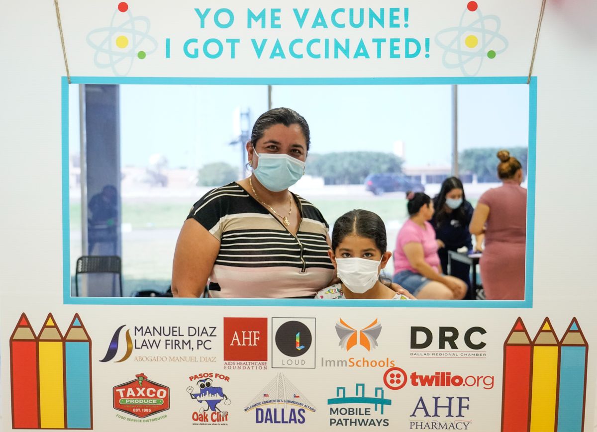 A mom and daughter attend a back to school vaccine drive for undocumented students organized by ImmSchools, a partner of the Mobile Pathways Vaccine Coalition