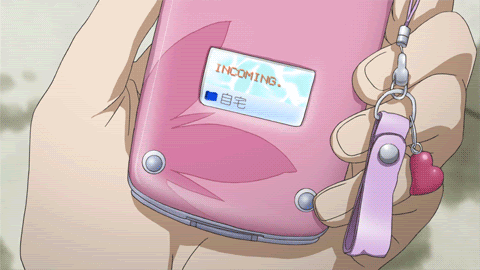 gif of pink cell phone from an anime with text that says "incoming..."