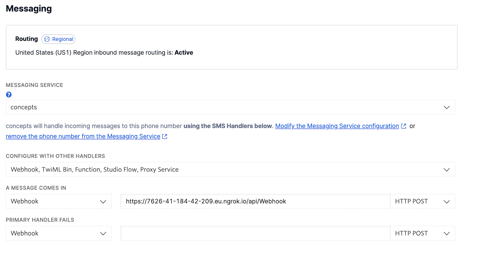 The Messaging section of the Twilio Phone Number configuration form.  You can see under "A MESSAGE COMES IN", a dropdown is set to "Webhook", followed by a text field with the ngrok forwarding URL and path to the webhook, followed by a dropdown set to "HTTP POST".