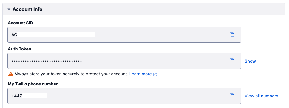 The account information section on Twilio Console which shows the Account SID, Auth Token (masked) and Twilio phone number