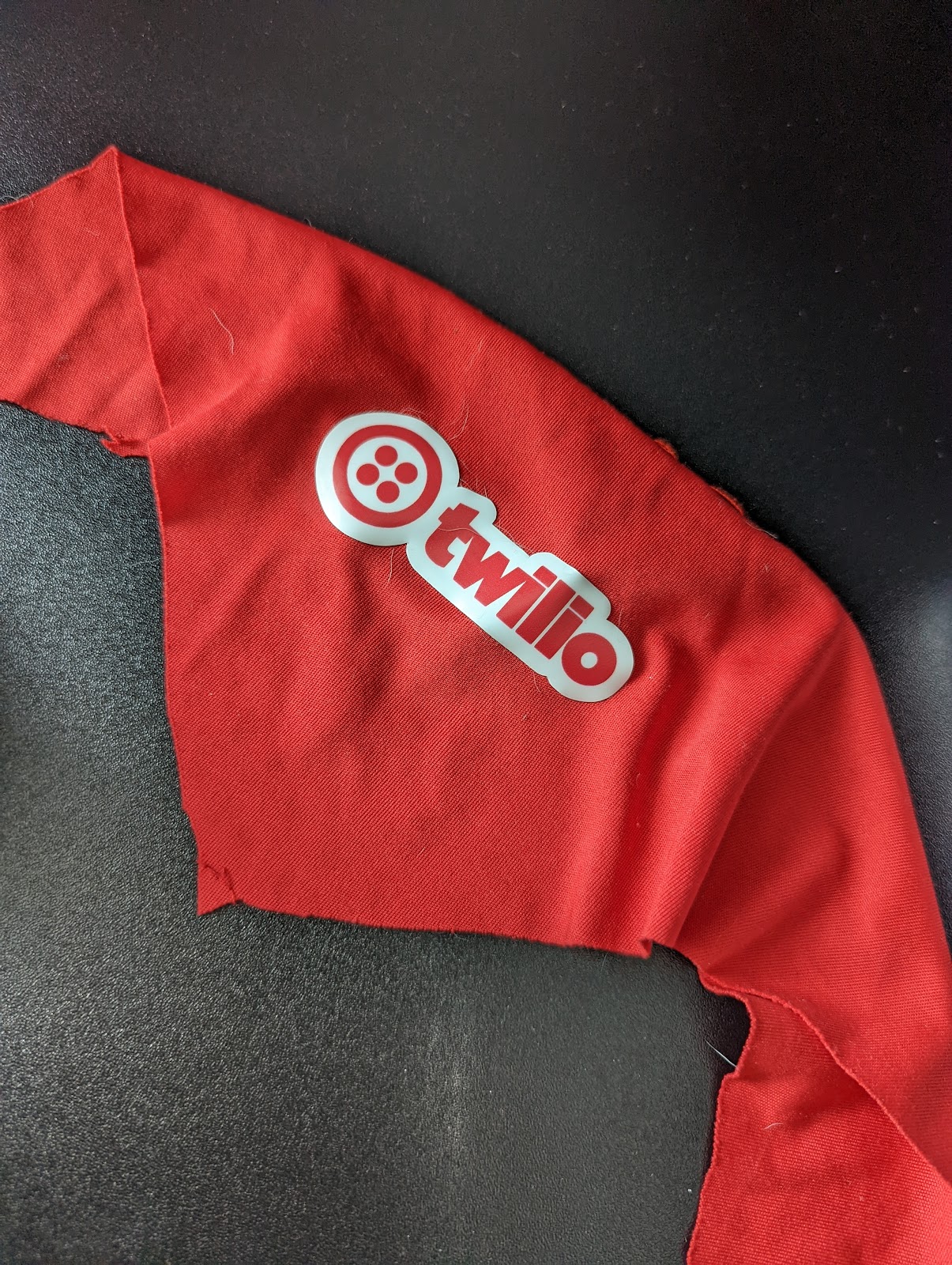 Twilio themed bandana with a pocket sewn in the back for the BLE tag